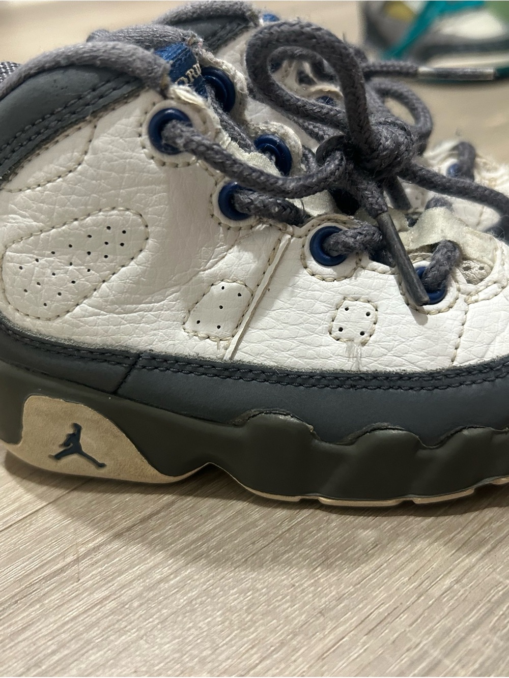 Jordan Kids White and Gray Retro Sneaker with Blue Eyelets
